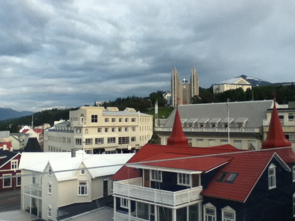 View of part of downtown Akureyri, looking up at the church. It's 10:10pm.